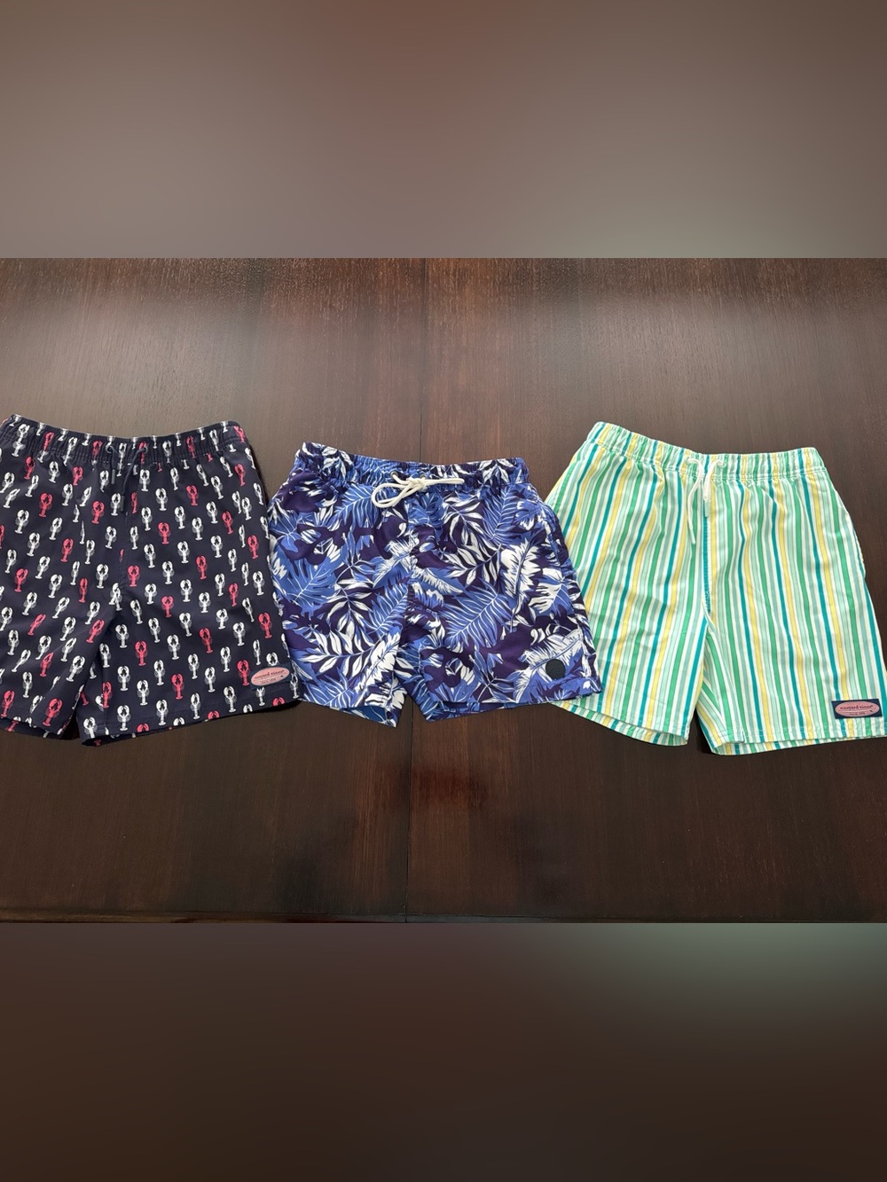 Three pairs of boys size large swim trunks- mesh cut out